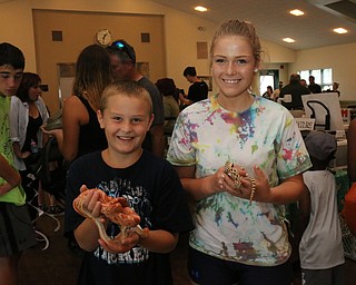 Dylan (8) and Jocelyn (14) Washington of Hubbard pose for a picture with Snakes during the Reptile and Amphibian show at the Mill Creek Farm in Canfield on Sunday afternoon. Dustin Livesay | The Vindicator 8/6/17 Canfield