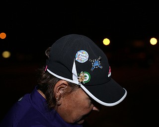 Gina Harper, aunt of Brooke Bobbey, shows off her pins from the game the Softball Little League World Series Champions return home, Sunday, August 6, 2017 in Poland...(Nikos Frazier | The Vindicator)