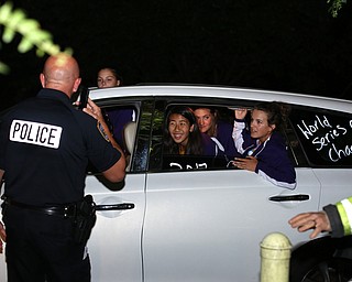 Officer Steve Kent congratulates the champions at Poland Methodist Church as the Softball Little League World Series Champions return home, Sunday, August 6, 2017 in Poland...(Nikos Frazier | The Vindicator)