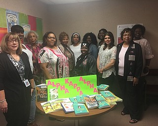 Alpha Kappa Alpha Sorority Inc., Epsilon Mu Omega (EMO) Chapter of Youngstown met recently with social workers of Youngstown City Schools and donated children’s books that can be used to work with children of parents who may have a mental illness, children who may be affected by bullying or have a type of mental illness themselves. The books provide information to help open a line of communication about those topics and are available for children and teens through 12th grade. Above, from left are Shelly Russ Taylor; LaToya Perry; Mary Lois Gross, EMO; Deanna Brown, EMO president; Mary Boyd; Jacqueline Brown; Robin Bradley, EMO; Sparkle Sanders; May Samad; Dr. Carol L. Staten, EMO vice president; and Christina Scissum.