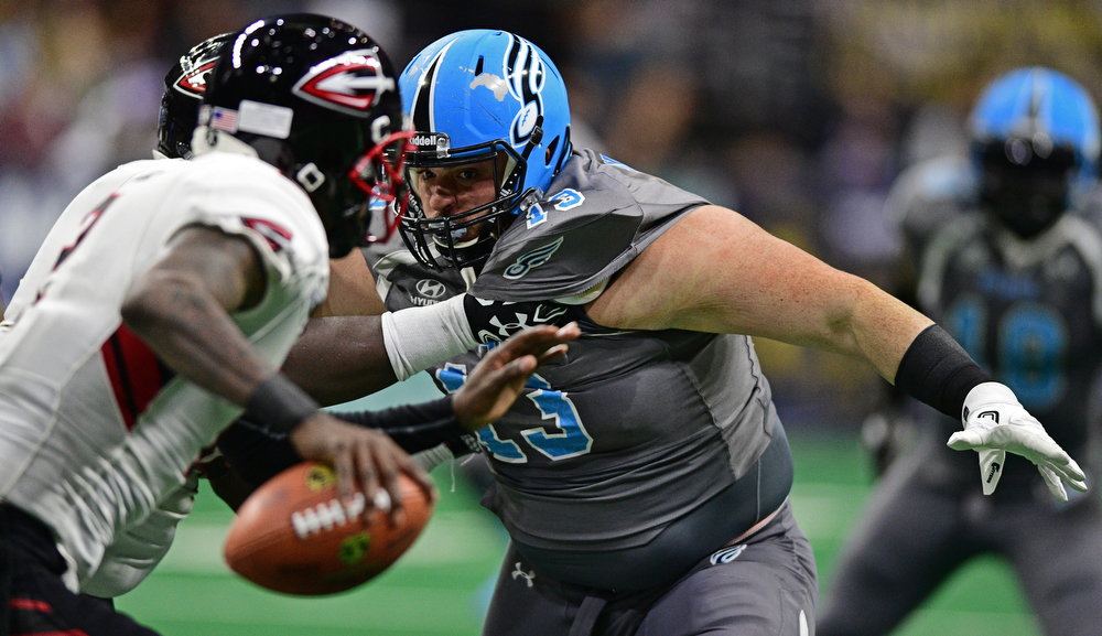 Philadelphia Soul defensive linemen Zach Zidian is held by Cleveland Gladiators offensive linemen Phillip-Keith Manley while chasing quarterback Arvell Nelson during their game on June 10, 2017 at the Wells Fargo Center in Philadelphia, Pennsylvania. DAVID DERMER | THE VINDICATOR