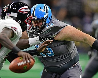 Philadelphia Soul defensive linemen Zach Zidian is held by Cleveland Gladiators offensive linemen Phillip-Keith Manley while chasing quarterback Arvell Nelson during their game on June 10, 2017 at the Wells Fargo Center in Philadelphia, Pennsylvania. DAVID DERMER | THE VINDICATOR