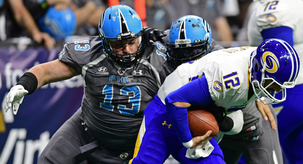 Philadelphia Soul defensive linemen Zach Zidian and linebacker Beau Bell sack Tampa Bay Storm quarterback Randy Hippeard during their game on June 17, 2017 at the Wells Fargo Center in Philadelphia, Pennsylvania. DAVID DERMER | THE VINDICATOR