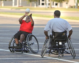 ROBERT K. YOSAY | THE VINDICATOR.almost out at second as Jayden Brown of Youngstown catches the ball on second as Liston Spann goes toward second as The Adaptive Sports Program of Ohio - wheelchair softball - at the Covelli Centre parking lot