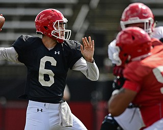 YOUNGSTOWN, OHIO - AUGUST 8, 2017: Youngstown State's Hunter Wells throws a pass from the pocket during the teams practice Tuesday morning at Stambaugh Stadium. DAVID DERMER | THE VINDICATOR