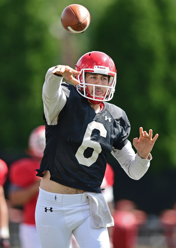 YOUNGSTOWN, OHIO - AUGUST 8, 2017: Youngstown State's Hunter Wells throws a pass from the pocket during the teams practice Tuesday morning at Stambaugh Stadium. DAVID DERMER | THE VINDICATOR