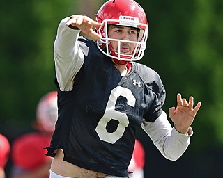 YOUNGSTOWN, OHIO - AUGUST 8, 2017: Youngstown State's Hunter Wells throws a pass from the pocket during the teams practice Tuesday morning at Stambaugh Stadium. DAVID DERMER | THE VINDICATOR