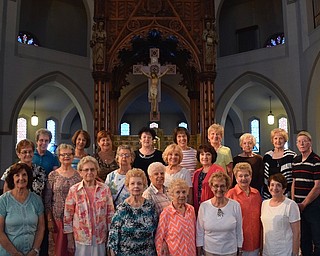 Bill Crawford, historian for Youngstown’s St. Patrick Church on Oak Hill Avenue, recently conducted a tour of the church for members of St. Christine’s Infant Jesus of Prague association. The 106-year-old Gothic-style church has 72 stained-glass windows and an oak baldachino with statues of the four evangelists, Matthew, Mark, Luke and John, as well as likenesses of Sts. Patrick, Peter, Paul and Columba. Above, first row, from left, are Mary Lou Hudak, Pat Emborsky, Cathy Campana, Betty Conway, Helen Zynski, Julie Mullally, Ann LoVaglio and Patti Griffin. Middle row, from left, are Ruth Spencer, Elaine Donchess, Bonnie Brooks, Dottie Stefko and Dee Iacone. Back row, from left, are Pat Hughes, Marietta Leslie, Pauline Antronica, Judy Rehak, Mary Ann Kane, Pat See, Ann Komara, Beverly Magda and Crawford.