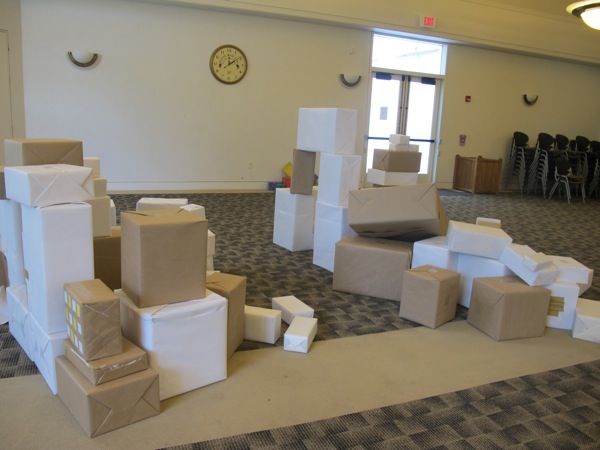 Neigbors | Alexis Bartolomucci.Cardboard boxes filled the room at Austintown library for children to use to build different objects on July 8.