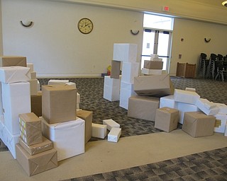 Neigbors | Alexis Bartolomucci.Cardboard boxes filled the room at Austintown library for children to use to build different objects on July 8.
