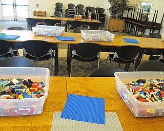 Neighbors | Alexis Bartolomucci.Legos were set up on the tables at the Austintown library for guests at the Life Size Building program to create different objects.