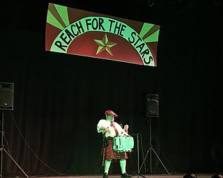Neighbors | Alexis Bartolomucci.One of the Purple Cat clients played the drums to the song "Amazing Grace" for the audience at the talent show on July 15.