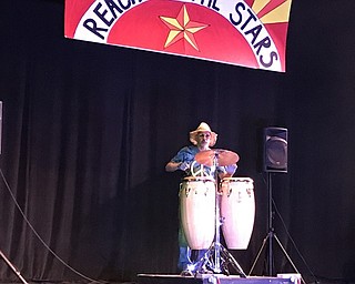 Neighbors | Alexis Bartolomucci.A Purple Cat client took the audience back in time to Woodstock as he played the congos on July 15 at the Youngstown Playhouse for the talent show.