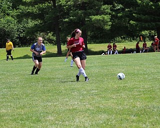 Neighbors | Abby Slanker.A member of the Canfield High School girls soccer team passed the ball during a game at the ninth annual Cardinal Classic Canfield High School Soccer Tournament hosted by the Canfield Soccer Boosters on July 8.