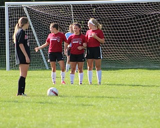 Neighbors | Abby Slanker.Members of the Canfield High School girls soccer team lined up to block a shot during a game on July 8.