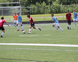 Neighbors | Abby Slanker.On July 9, a member of the Canfield High School boys soccer team moved the ball down the field during a game at the Cardinal Classic Canfield High School Soccer Tournament hosted by the Canfield Soccer Boosters.