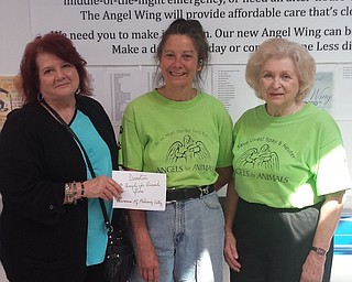 Newcomers of Mahoning Valley made donations to several local charities this year. Among them is the capital campaign for Angels for Animals, which is raising money to build a wing that will be a model for animal welfare. It will increase the number of spay or neuter surgeries performed and provide increased care and intake of abandoned animals. Above, from left, are Jorine Stone, president of Newcomers, presenting a check for the capital campaign to Diane Less, co-founder of Angels for Animals, and Alice Marchione, Angels for Animals volunteer. Anyone interested in helping Angels for Animals achieve its goal can call Less at 330-502-5352.