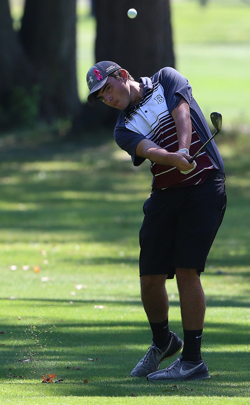 8-16-17 GOLF Boys  Boardman Spartans vs Howland Tigers at Tamer Wind Course, Cortland, OH..Boardman's Cody Geary hits his approach shot on the 17th.