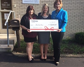 The Beatitude House accepts a “Christmas in July” grant of $10,000 from the FirstEnergy Foundation. Above, from left, are Kathleen Moliterno, development director at Beatitude House; Gina Pastella, executive director of Beatitude House; and Laura Tubo, external affairs manager for Ohio Edison.