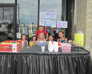 Neighbors | Alexis Bartolomucci.Children from the Boo Squad set up a lemonade stand at the Chic Chateau to help raise money for families in need.