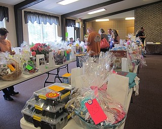 Neighbors | Alexis Bartolomucci.Guests looked at the gift baskets that were donated as part of the 50/50 raffle for the West Side Cats Annual Motorcycle Run on July 16.