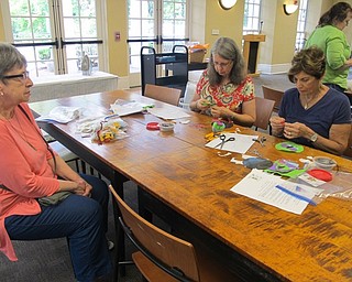 Neighbors | Alexis Bartolomucci.Guests at the Poland library's Beginner Applique program on June 19 learned how to sew pin cushions with the help of members from the Youngstown Embroiderer's Guild.