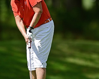 BOARDMAN, OHIO - AUGUST 18, 2017: Joan Ash follows through on her putt on the 18th hole of the South Course, Friday afternoon during the Vindicator Greatest Golfer Tournament. DAVID DERMER | THE VINDICATOR