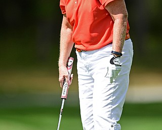 BOARDMAN, OHIO - AUGUST 18, 2017: Joan Ash reacts after missing a short putt on the 18th hole of the South Course, Friday afternoon during the Vindicator Greatest Golfer Tournament. DAVID DERMER | THE VINDICATOR
