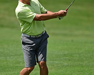 BOARDMAN, OHIO - AUGUST 18, 2017: Michael Porter follows through on his approach shot on the 6th hole of the North Course, Friday afternoon during the Vindicator Greatest Golfer Tournament. DAVID DERMER | THE VINDICATOR