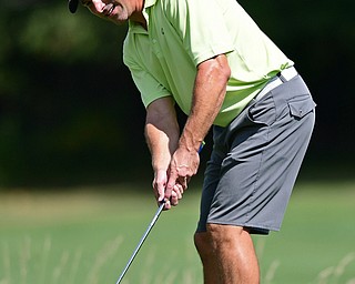 BOARDMAN, OHIO - AUGUST 18, 2017: Michael Porter follows through on is putt on the 6th hole of the North Course, Friday afternoon during the Vindicator Greatest Golfer Tournament. DAVID DERMER | THE VINDICATOR