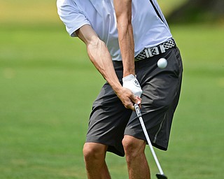BOARDMAN, OHIO - AUGUST 18, 2017: Brandon Pluchinsky chips from he fairway to the green on the 6th hole of the North Course, Friday afternoon during the Vindicator Greatest Golfer Tournament. DAVID DERMER | THE VINDICATOR