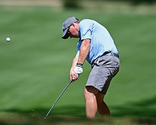 BOARDMAN, OHIO - AUGUST 18, 2017: Lance Price follows through on his approach shot on the 7th hole of the North Course, Friday afternoon during the Vindicator Greatest Golfer Tournament. DAVID DERMER | THE VINDICATOR