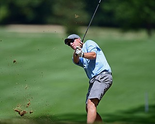 BOARDMAN, OHIO - AUGUST 18, 2017: Lance Price follows through on his approach shot on the 7th hole of the North Course, Friday afternoon during the Vindicator Greatest Golfer Tournament. DAVID DERMER | THE VINDICATOR