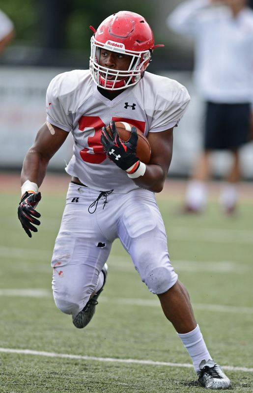 YOUNGSTOWN, OHIO - AUGUST 19, 2017: Youngstown State's Tevin McCaster runs the ball during the teams practice Saturday morning at Stambaugh Stadium. DAVID DERMER | THE VINDICATOR