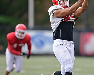 YOUNGSTOWN, OHIO - AUGUST 19, 2017: Youngstown State's Anthony Parente goes up to make a catch during the teams practice Saturday morning at Stambaugh Stadium. DAVID DERMER | THE VINDICATOR