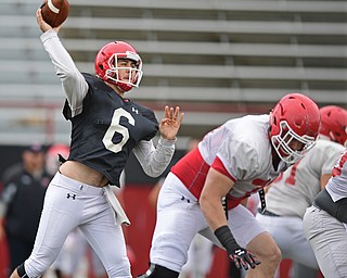 YOUNGSTOWN, OHIO - AUGUST 19, 2017: Youngstown State's Hunter Wells throws a pass from the pocket during the teams practice Saturday morning at Stambaugh Stadium. DAVID DERMER | THE VINDICATOR