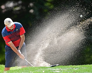 LIBERTY, OHIO - AUGUST 19, 2017: Joe Alfano Sr. chips out of the bunker on the 6th hole, Saturday afternoon during the Vindy Greatest Golfer at Youngstown Country Club. DAVID DERMER | THE VINDICATOR