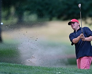 LIBERTY, OHIO - AUGUST 19, 2017: Paul Harris chips out of the bunker on the 6th hole, Saturday afternoon during the Vindy Greatest Golfer at Youngstown Country Club. DAVID DERMER | THE VINDICATOR