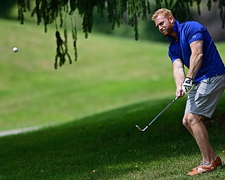 LIBERTY, OHIO - AUGUST 19, 2017: Joe Costantini chips from the short rough onto the green on the 6th hole, Saturday afternoon during the Vindy Greatest Golfer at Youngstown Country Club. DAVID DERMER | THE VINDICATOR