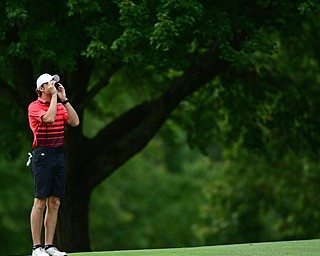 LIBERTY, OHIO - AUGUST 19, 2017: Dylan Portolese uses his range finder to measure the distance to the pin on the 11th hole, Saturday afternoon during the Vindy Greatest Golfer at Youngstown Country Club. DAVID DERMER | THE VINDICATOR