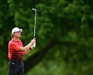 LIBERTY, OHIO - AUGUST 19, 2017: Dylan Portolese watches as his approach shot flies toward the green on the 11th hole, Saturday afternoon during the Vindy Greatest Golfer at Youngstown Country Club. DAVID DERMER | THE VINDICATOR