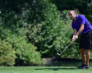 LIBERTY, OHIO - AUGUST 19, 2017: Matt Mowery chips onto the green from the short rough on the 9th hole, Saturday afternoon during the Vindy Greatest Golfer at Youngstown Country Club. DAVID DERMER | THE VINDICATOR