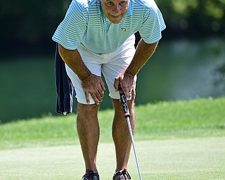 LIBERTY, OHIO - AUGUST 19, 2017: Ron Snyder reads the green on the 9th hole, Saturday afternoon during the Vindy Greatest Golfer at Youngstown Country Club. DAVID DERMER | THE VINDICATOR