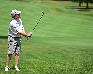 LIBERTY, OHIO - AUGUST 19, 2017: Jim Lapolla watches as his chip shot flies toward the green on the 5th hole, Saturday afternoon during the Vindy Greatest Golfer at Youngstown Country Club. DAVID DERMER | THE VINDICATOR