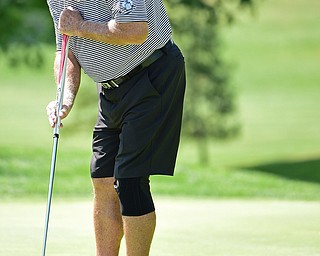 POLAND, OHIO - AUGUST 20, 2017: Tom Porter putts on the 18th hole during the final round of the Vindy Greatest Golf Tournament, Sunday afternoon at the Lake Club. DAVID DERMER | THE VINDICATOR
