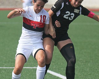 William D. Lewis The Vindicator  YSU's Ruth Penna(10) and Bonaventure's Sydney Cassagnol(23) go for the ball during season opener Monday 8-21-17 at YSU.