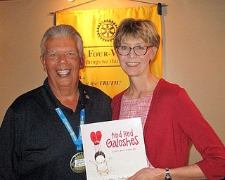 Judge Mary DeGenaro of the 7th District Court of Appeals addressed members of the Rotary Club of Austintown at a recent meeting. She explained the jurisdiction of the court in eastern Ohio and the kinds of rulings handed down in an appeal. Judge DeGenaro has served on the court since 2000, and she encouraged members to be willing to serve on juries and to study candidates carefully in elections. Above, from left, President Bruce Laraway presents Judge DeGenaro with a book in her honor to be placed in the Austintown Elementary School library.