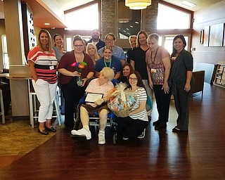 Greenbriar Healthcare Center recently requested “Who is your Hero?” nominations from staff, residents and community members. Greenbriar’s hero is a resident, Janice Guy, She was nominated by a staff member who has watched her accomplish things regardless of the challenges she faces. Guy, who taught history at Struthers High School for 25 years, also was nominated by a former student who is grateful for her guidance. Guy was rewarded with a trip to the beauty shop, and she was showered with gifts from the staff at Greenbriar. Above, Guy is shown being presented with her award. She thanked the staff for nominating her.