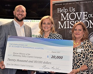 The Rescue Mission of the Mahoning Valley, 962 Martin Luther King Jr. Blvd., Youngstown, was the recipient recently of a gift of $20,000 from the employees of St. Elizabeth Boardman Hospital. This contribution was generated over multiple years through a variety of employee-driven fundraising events. The donation was made in support of the Rescue Mission’s “Move Our Mission” capital campaign. Above, from left, John Muckridge, president and CEO of the Rescue Mission, is presented with a check by Genie Aubel, president of St. Elizabeth Boardman Hospital, and Gina Mook, administrative assistant for nursing administration.