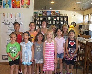 Neighbors | Alexis Bartolomucci.Children at the Wonderstruck Market stood with their teacher, Elyssa Stishan, during their art camp lesson on July 18.